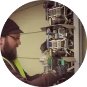 Expert technician repairing a solar inverter for residential photovoltaic systems